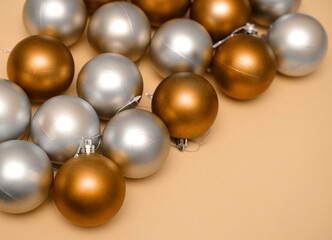 golden christmas balls on orange background