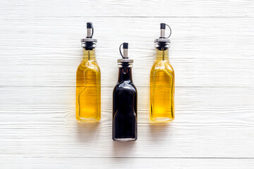 Balsamic and apple cider vinegar in glass bottles top view