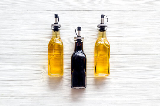 Balsamic And Apple Cider Vinegar In Glass Bottles Top View