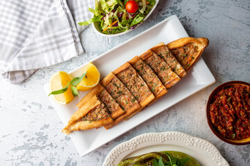 Traditional delicious Turkish food, meat pide (Turkish name; Kusbasi etli pide)