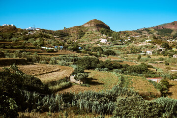Fototapeta na wymiar Mountain landscape with farm fields and small houses
