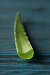 Aloe vera leaf on rustic wooden background