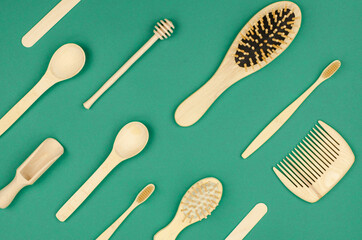 Natural wooden items for household and personal hygiene. Wooden combs, toothbrushes, spoons on a...