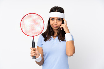 Young badminton player woman over isolated white background thinking an idea