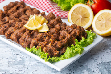 Traditional delicious Turkish food; Turkish name; Cig kofte (raw meatball in Turkish) with lettuce