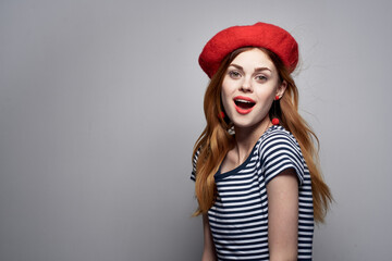 Naklejka premium beautiful woman wearing a red hat makeup France Europe fashion posing summer