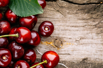 Ripe red cherries on a wooden table