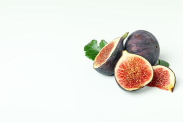 Fig with leaves on white background, space for text