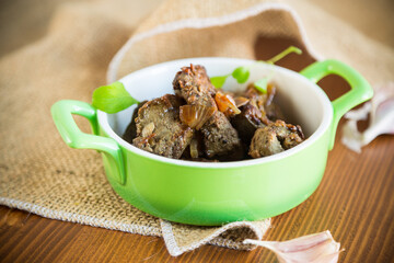 fried liver with onions and spices in a plate