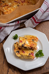 Homemade quark or curd casserole with mushrooms, red bell pepper and cheese. Healthy food, vegetarian protein-rich meal