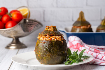 Zucchini stuffed with meat, rice and vegetables. Traditional delicious Turkish food, mini ball stuffed zucchini (Turkish name; top kabak dolmasi)