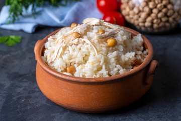 Traditional delicious Turkish food; Rice with chickpeas and chicken (Turkish name; Tavuklu nohutlu pilav or pilaf)