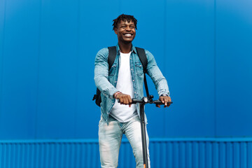 modern african american on electric scooter, business man is one to work, student is one to study