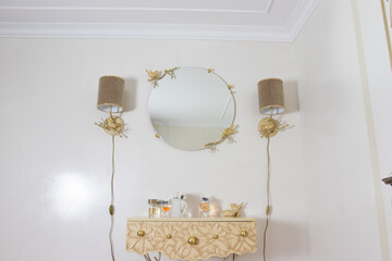 dressing table with a mirror for cosmetics in the hallway of a large house