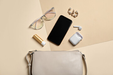 Flat lay composition with stylish woman's bag on color background