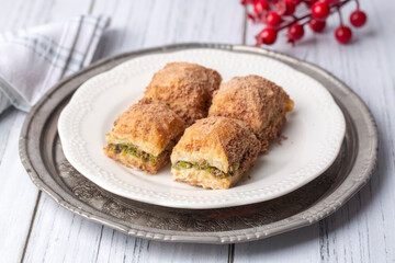 Traditional turkish new dessert cold milky baklava with pistachio (Turkish name; soguk baklava)