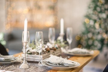 Decorated christmas served table in cozy atmosphere