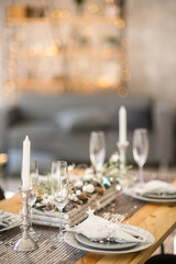 Decorated christmas served table in cozy atmosphere