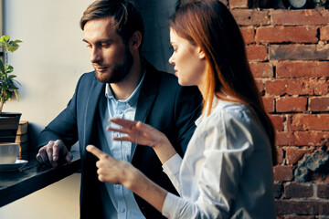 business man and woman in a cafe communication professionals