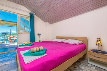 Interior of a room for rent on the sea shore. Apartment Carpet Diem in Utjeha, Montenegro.