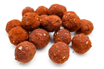 Chocolate homemade candy truffles isolated on white background. Homemade cooking background