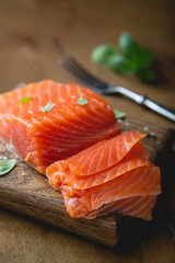 A piece of smoked salmon, cut into thin slices