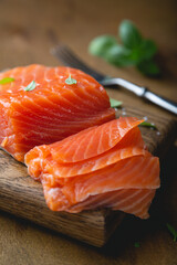 A piece of smoked salmon, cut into thin slices