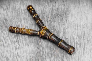 african ancient shamanic slingshot carved from wood for rituals