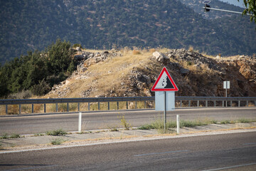 car sign Falling stones on the road in Turkey, be careful, stones may fall from the mountain