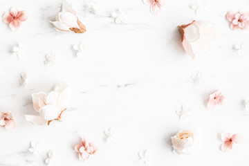 Flowers composition. White and pink flowers on marble background. Flat lay, top view - 456727279
