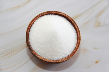 sweet white granulated sugar in a plate