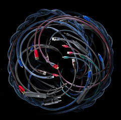 Different audio cables composition on black background