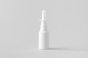 Nasal spray mockup. White plastic bottle with blank label.