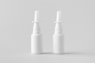 Nasal spray mockup. White plastic bottle with blank label.