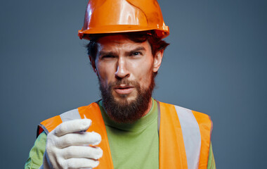 man in construction uniform orange helmet work