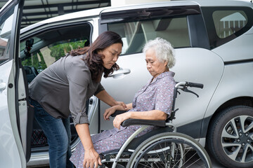 Help and support asian senior or elderly old lady woman patient prepare get to her car.