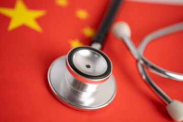 Stethoscope on China flag, check problem of business and finance concept.