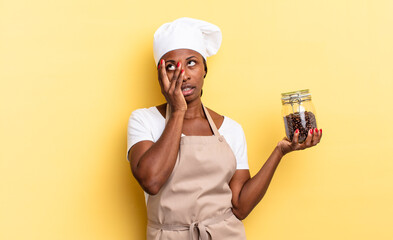 black afro chef woman feeling bored, frustrated and sleepy after a tiresome, dull and tedious task,...
