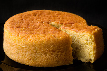 Brown topped cylindrical store-bought Banana cake
