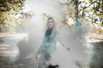 Fototapeta premium Mystical Halloween party and masquerade ideas, people outfits, scene in the forest