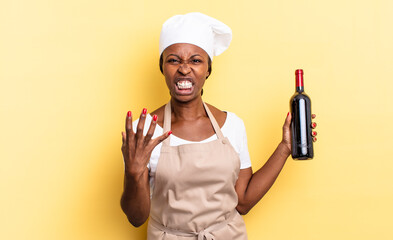 black afro chef woman looking angry, annoyed and frustrated screaming wtf or what’s wrong with...