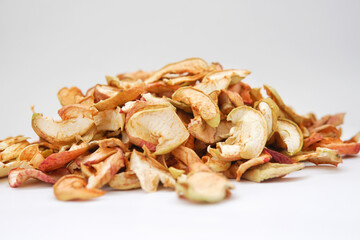 Homemade dried organic apple sliced on wood background
