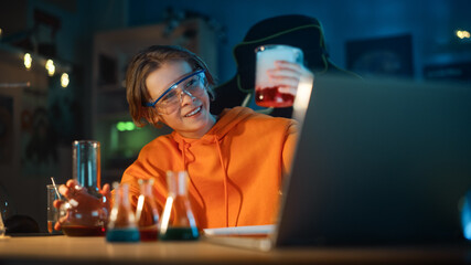 Smart Young Boy in Safety Goggles Mixes Colorful Chemicals in Beakers at Home. Teenager Conducting Educational Science Hobby Experiments, Doing Interesting Biology Homework in His Room.