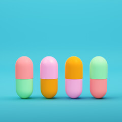 Colorful capsule pills on bright blue background in pastel colors. Minimalism concept