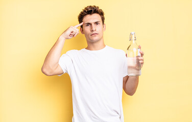 feeling confused and puzzled, showing you are insane, crazy or out of your mind. water bottle...