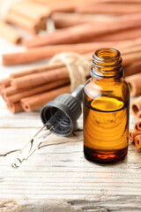 cinnamon essential oil in the glass bottle