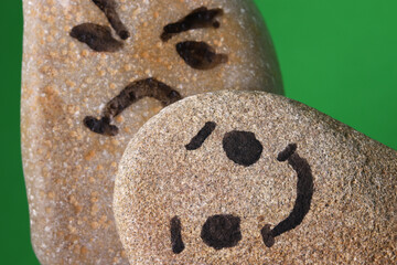 face shape drawn in a stone