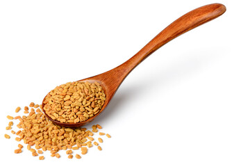 fenugreek seeds in the wooden spoon, isolated on the white background