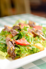 Salad with beef, tomatoes, fresh lettuce salad and arugula, raw mushrooms and great dressing from dijon mustard.