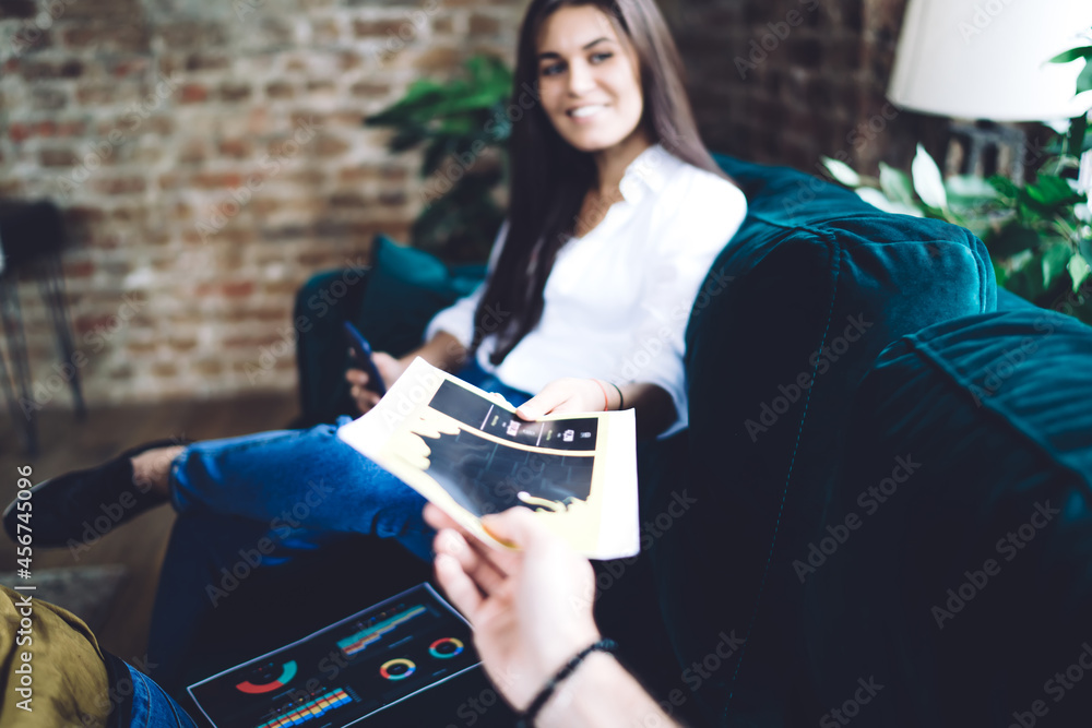 Poster blurred view of successful caucasian woman spending daytime for working remotely with colleague take